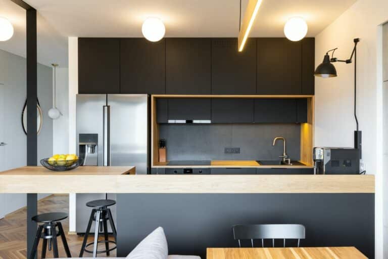 black wooden furniture and an industrial lamp above a coffee mac e1604308501463.jpg